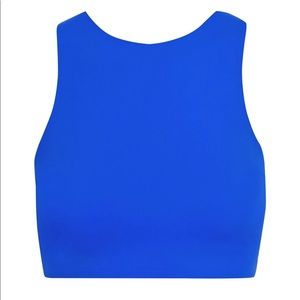 REEBOK X VICTORIA BECKHAM
Cropped logo-appliquéd stretch top Size L bright blue